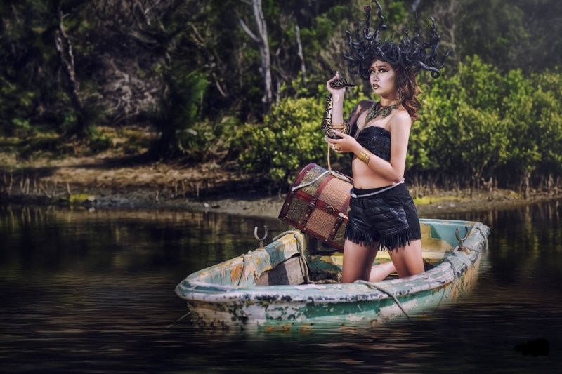 leisure activity, real people, one person, boat, tree, women outdoors, snake, Medusa, lifestyles, nautical vessel, full length, casual clothing, outdoors