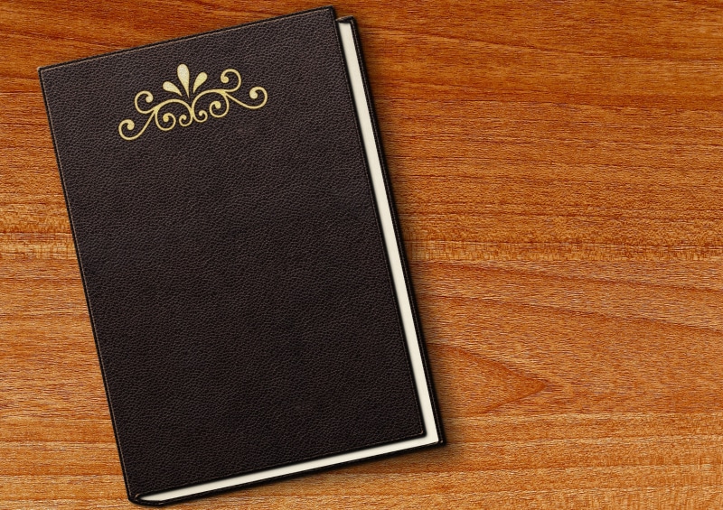 read, wood - material, greeting card, decoration, personal organizer, directly above, leather, high angle view, books, no people, table, indoors, note pad