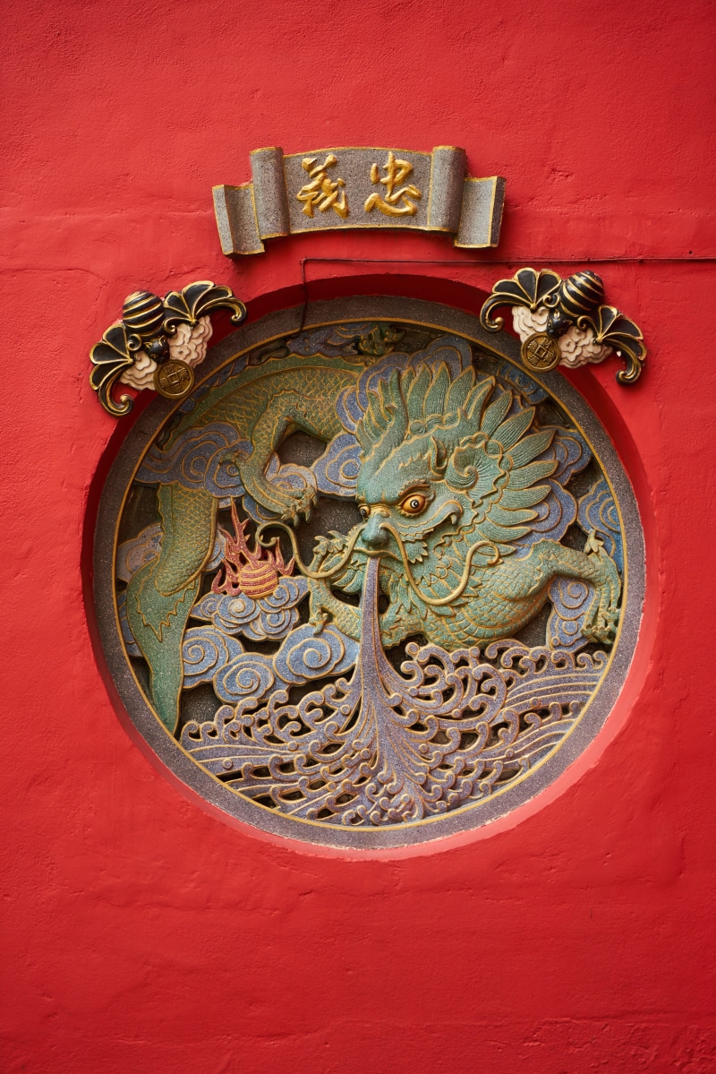 religion, gray, spirituality, antique, luxury, red, temple, artwork, animal representation, belief, emboss, taoism, art and craft, wall - building feature