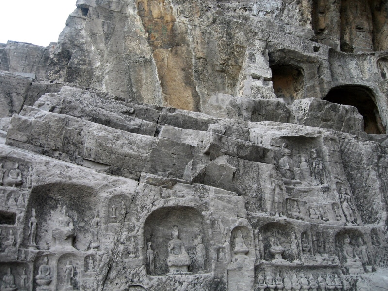 built structure, longman grottoes, emboss, the past, low angle view, place of worship, stone, day, belief, no people, design, ancient civilization, architecture