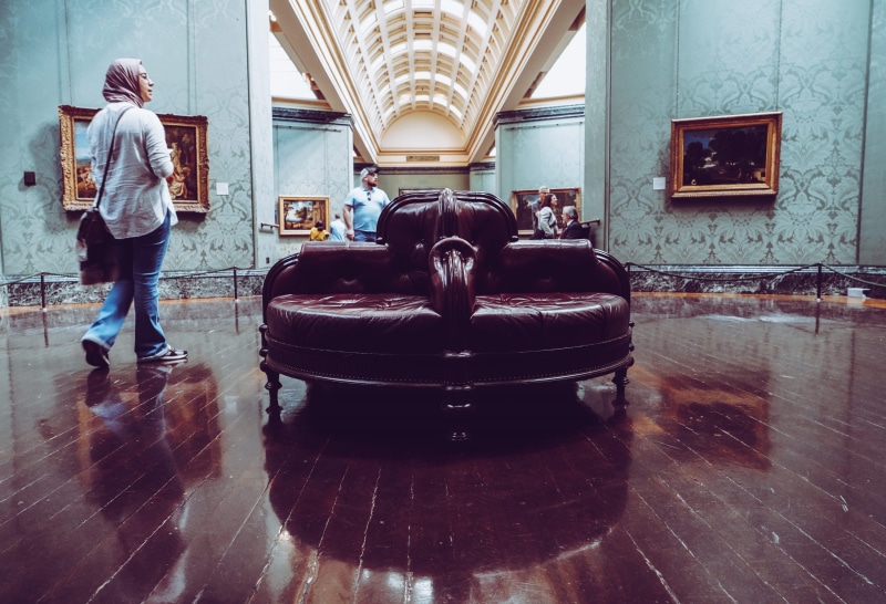 hardwood, wood, couch, transportation, real people, sofa, mode of transportation, rear view, brown, one person, shiny, inside, built structure, leisure activity