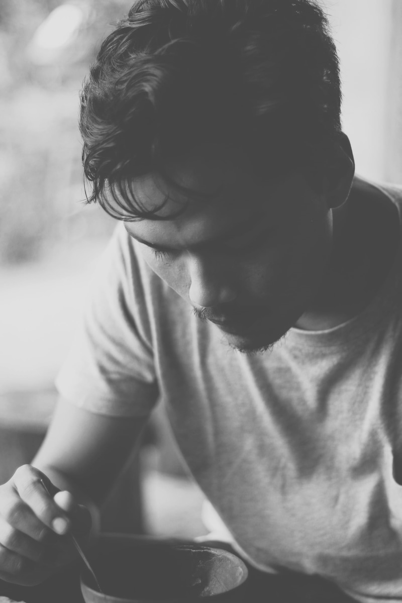 hairstyle, headshot, looking, human, black-and-white, focus on foreground, outdoors, leisure activity, looking down, lifestyles, boy, front view, waist up