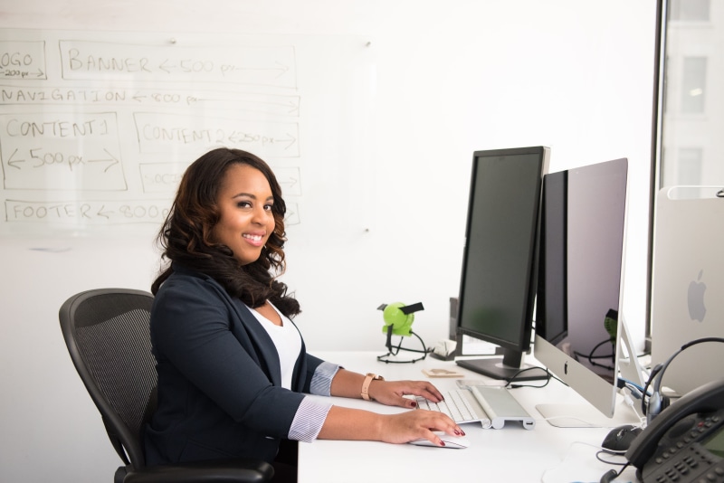 sit, laptop, smile, keyboard, woman, armchair, working, room, smiling, rolling, communication, silver, looking, black, looking at camera, using computer