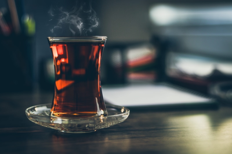 close, tea - hot drink, beverage, crockery, hot drink, freshness, table, food and drink, black, glassware, black tea, tea, drinking glass, smoke - physical structure