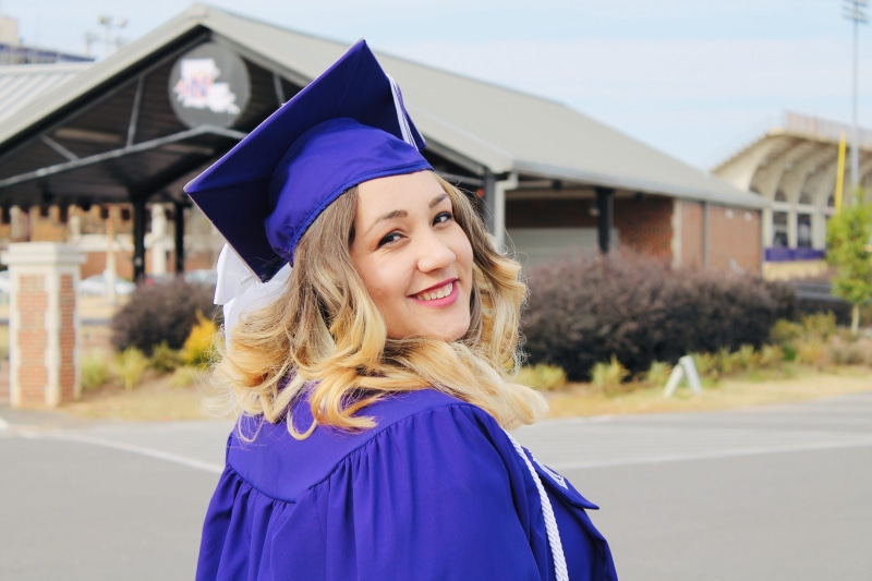 smile, emotion, university, student, hair, happy, lifestyle, robe, blond hair, wearing, outdoors, graduation, ceremony, education, cap, fun, college, positive emotion