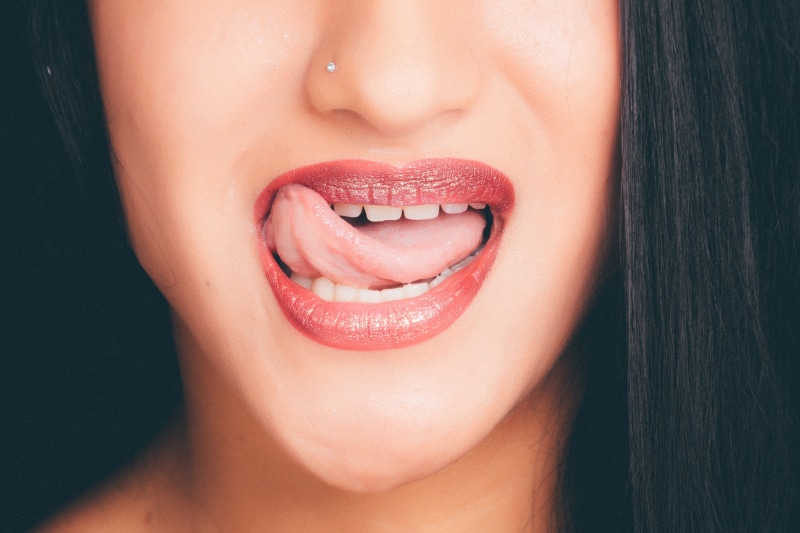 smiling, make-up, studio shot, 5K, close-up, mouth open, human mouth, one person, human lips, woman, adult, girl, human face, photoshoot, beautiful woman
