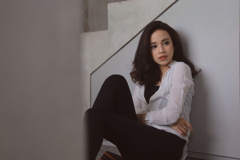 woman, portrait, button, person, women, photoshoot, looking at camera, shirt, facial expression, model, casual clothing, studio, wall - building feature