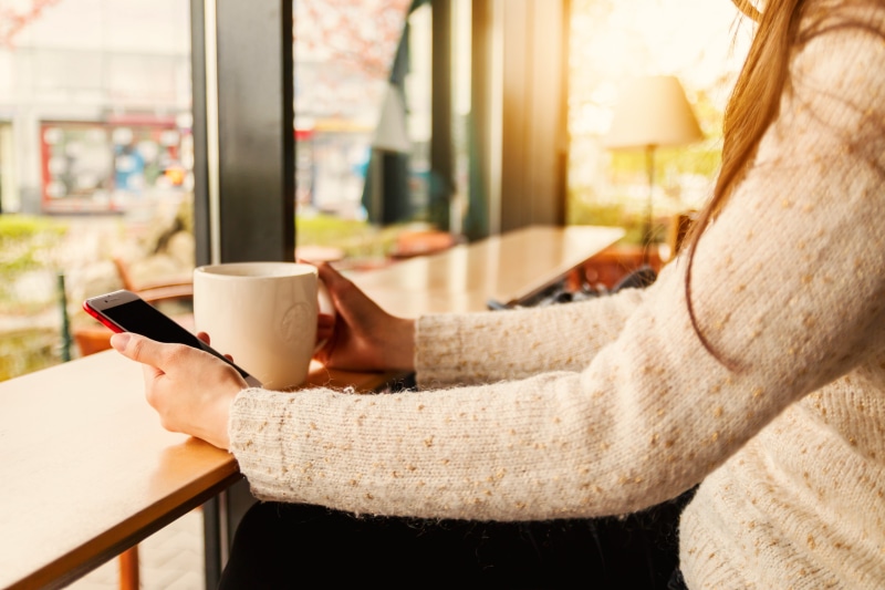 adult, wireless technology, coffee, mobile phone, holding, cafe, indoors, drink, human body part, connection, relaxation, uses, coffee - drink, portable information device