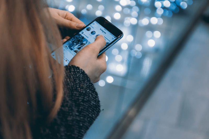 human body part, selective focus, finger, instagram, one person, human hand, touch screen, wireless technology, close-up, illuminated, mobile phone, connection
