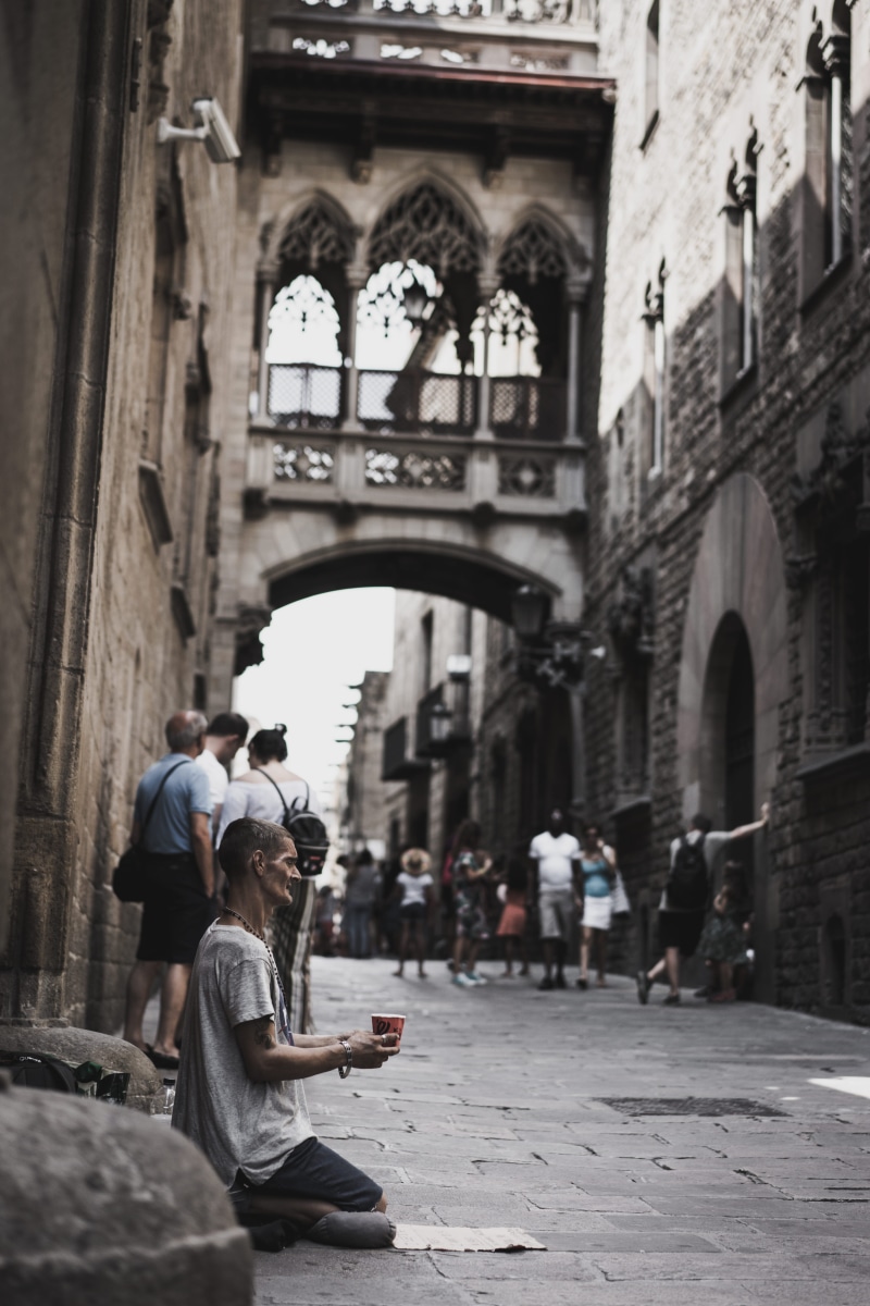 street, casual clothing, incidental people, couple - relationship, people, alone, alms, day, 5K, spain, building, arch, charity, real people, begging