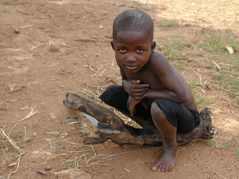 one person, males, rwanda, african, knife, leisure activity, africa, boys, full length, land, poverty, dirt, front view, boy, 2K, childhood, portrait