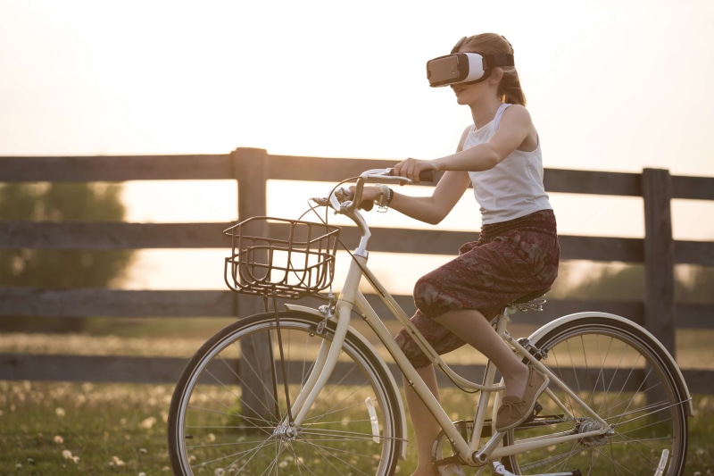 royalty  imag, vr, virtual reality headset, activity, cyclist, focus on foreground, full length, bicycle, day, land vehicle, bike, person, mode of transportation