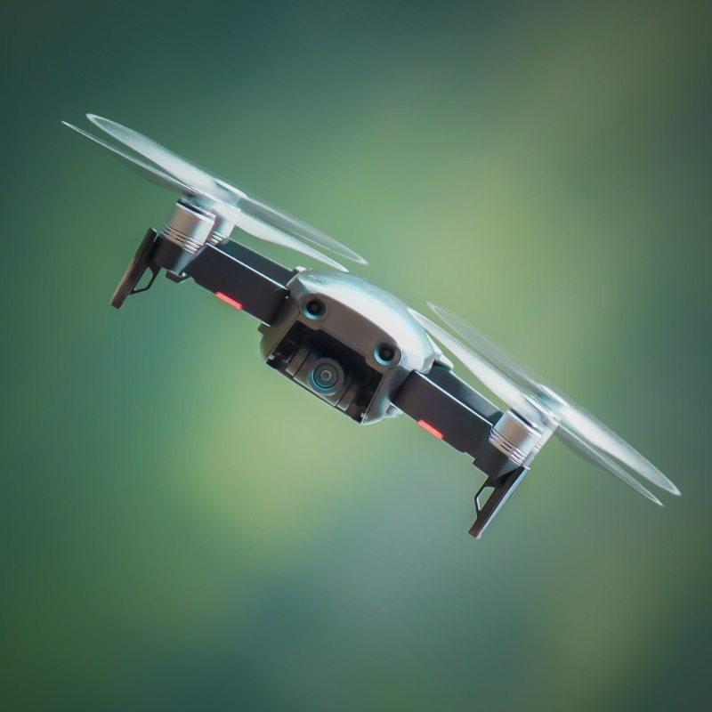 photography, sharp, science, day, security, robot, single object, black, gray, flight, flying, focus, closeup, bokeh, weapon, indoors, still life, no people