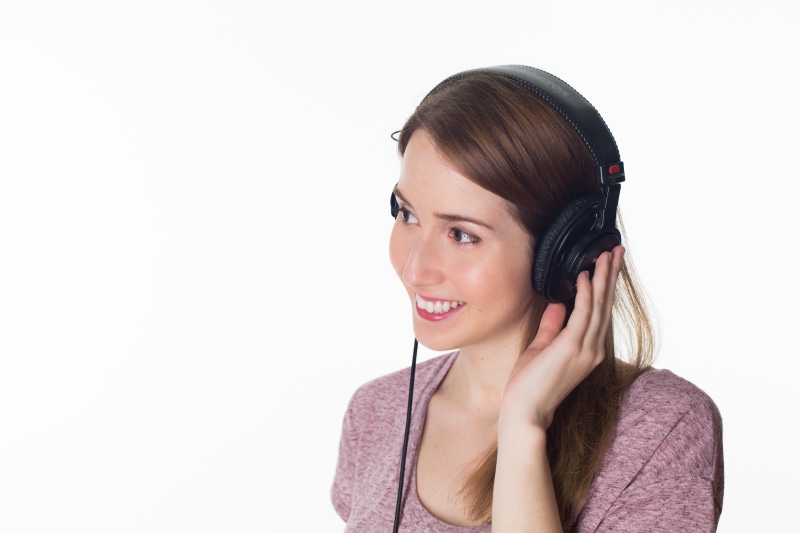 females, enjoyment, emotion, indoors, tranquility, listening, relaxes, headshot, headphones, girl, woman, smile, one Person, adult, white background, caucasian Ethnicity