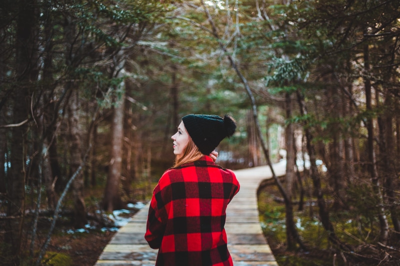 plant, focus on foreground, poncho, cap, building, leisure activity, path, land, coat, cape, clothing, fashion, cloak, young adult, trees, walkway, lifestyles
