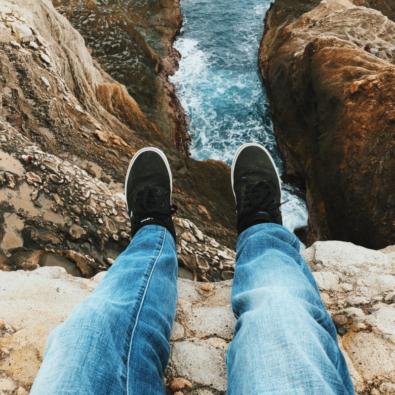 jeans, nature, low section, sea, leisure activity, vans, ocean, rocks, water, outdoors, human leg, pov, rock, solid, rock - object, shoe, human foot, coast