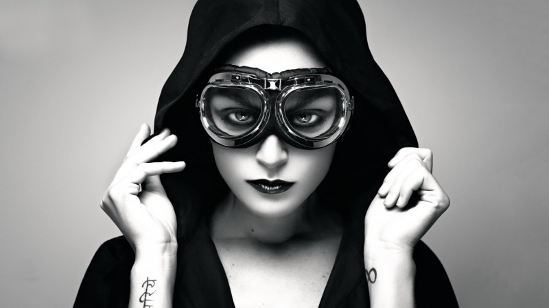 looking at camera, headshot, one person, face, real people, obscured face, mask, disguise, young women, hand, close-up, goggles, women, indoors, 1080P