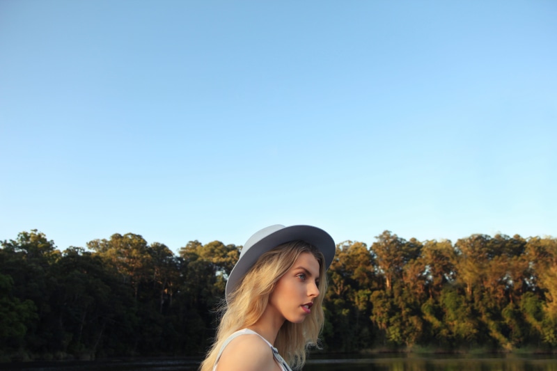 plant, wearing, woman, facing, nature, right, tree, blond Hair, summer, young Adult, body, hair, smiling, standing, river, sunhat, people, lake, day, water