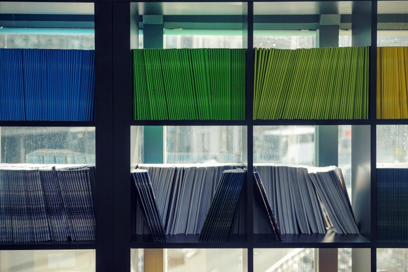 indoors, seat, window, library, office, lot, book, bookcase, nature, glass - material, built structure, black, color, file, storage, modern, assorted, green