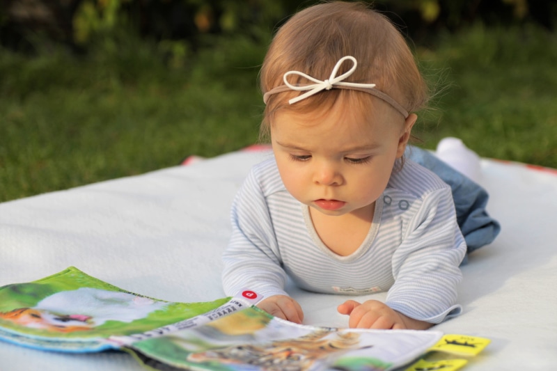 s, a small child, looking down, cute, females, day, daughter, neck, child, headshot, blond hair, crew, 5K, booklet, childhood, one person, sitting, top