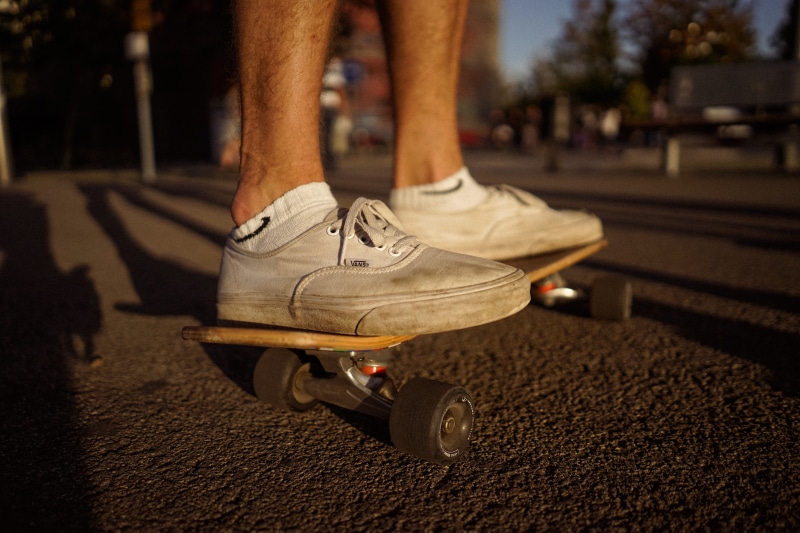 body part, mode of transportation, day, people, wearing, sport, road, skateboarding, urban Scene, low section, human body part, women, sunlight, human Foot