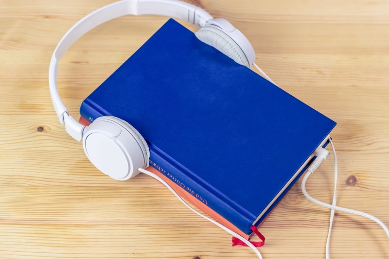 multimedia, high angle view, data, text, directly above, listen, information, blue, flooring, book pages, touch screen, publication, connection, tablet