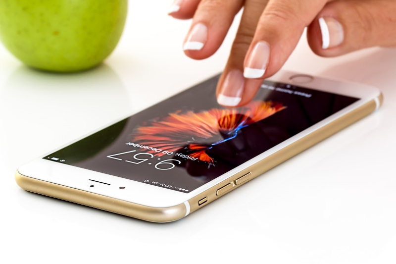 business, connected, cellphone, iphone, human body part, food and drink, communication, person, nail, adult, hand, finger, multimedia, telephone, people