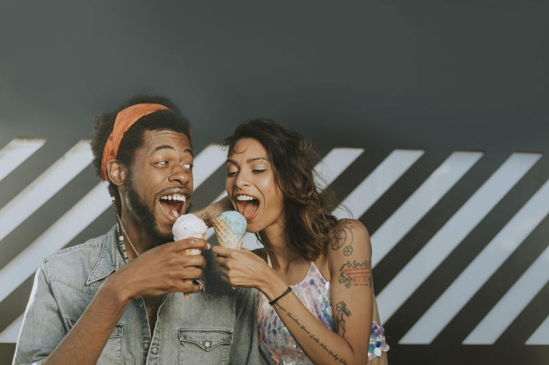 love, enjoy, smile, share, adult, mouth open, couple, headband, women, men, summer, crop top, tattoo, playful, food and drink, joyful, enjoyment, young adult