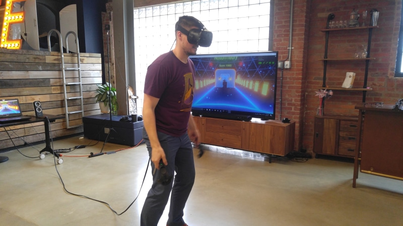full length, virtual reality, young men, indoors, looking, people, tech, one person, build, window, adult, men, technology, holding, man, mid adult, vr