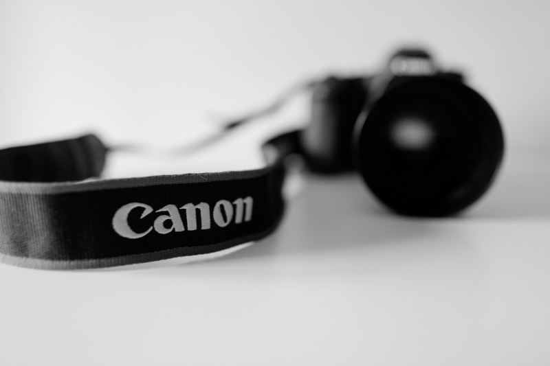 5K, indoors, headset, close-up, number, accessory, electronics, no people, cassette player, dslr, capital letter, text, strap, glasses, diamond, focus on foreground