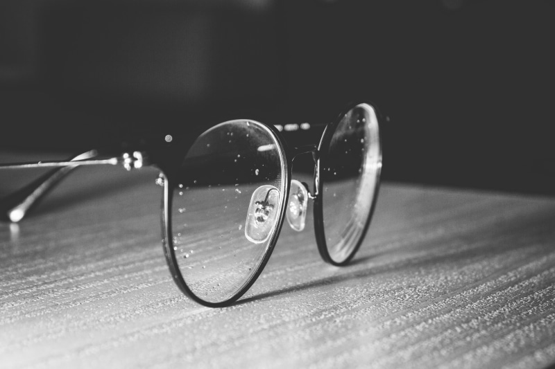 sunglasses, oval, computer, glass - material, eyesight, fashion, gemstone, single object, selective focus, 5K, focus on foreground, indoors, no people