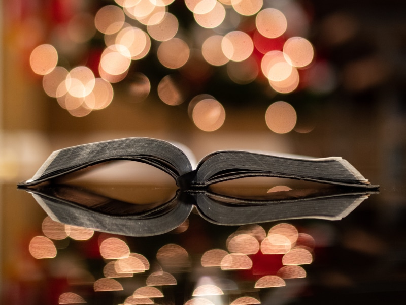 text, indoors, christmas lights, pattern, celebration, accessory, photography, bokeh, christmas ornament, clothing, holiday, gemstone, glasses, defocused