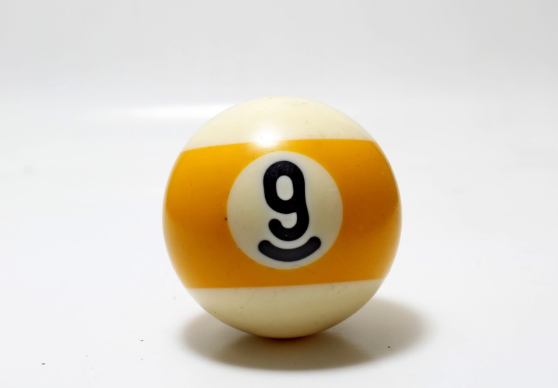 sphere, activity, white color, cut out, indoors, leisure, cheerful, color, single object, shiny, number, nine, equipment, happiness, laughing, food and drink