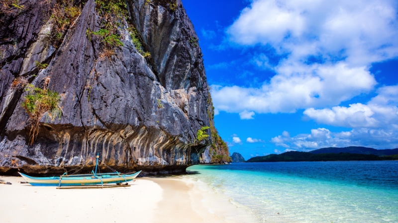 vacation, tropics, 5K, body of water, sea, rock, boat, sky, philippine sea, cliff, exotic, water, tourism, beach, summer, shore, coast, summertime, promontory
