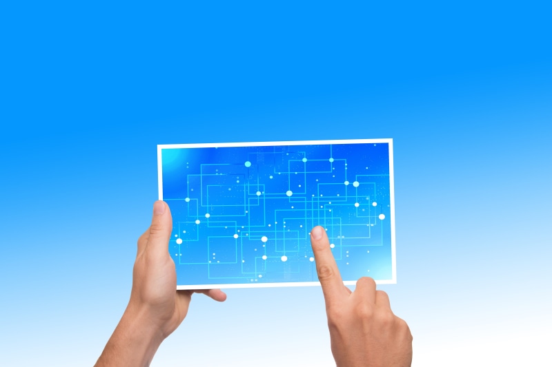 liquid-crystal display, adult, chip, holding, calculator, lines, blue background, connection, cpu, tablet, technology, finger, data, board, circuits, internet