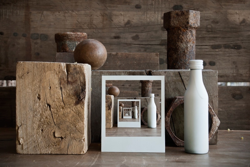 container, still life, shelf, metal, indoors, healthy eating, bottles, no people, choice, boxes, bottle, wood, recursion, group of objects, table, texture