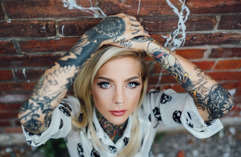leisure activity, tattoo, young women, 2K, looking at camera, hair, urban, face, arms, portrait, fashion, s, wall, lifestyles, hairstyle, bricks, brick wall