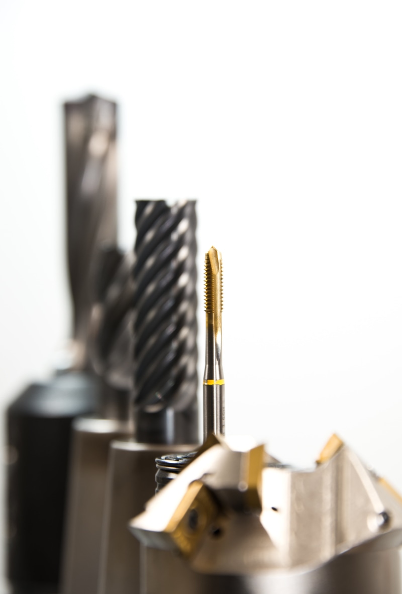 manufacturing, large group of objects, machine, indoors, selective focus, industry, copy space, no people, kitchen utensil, equipment, black color, drilling