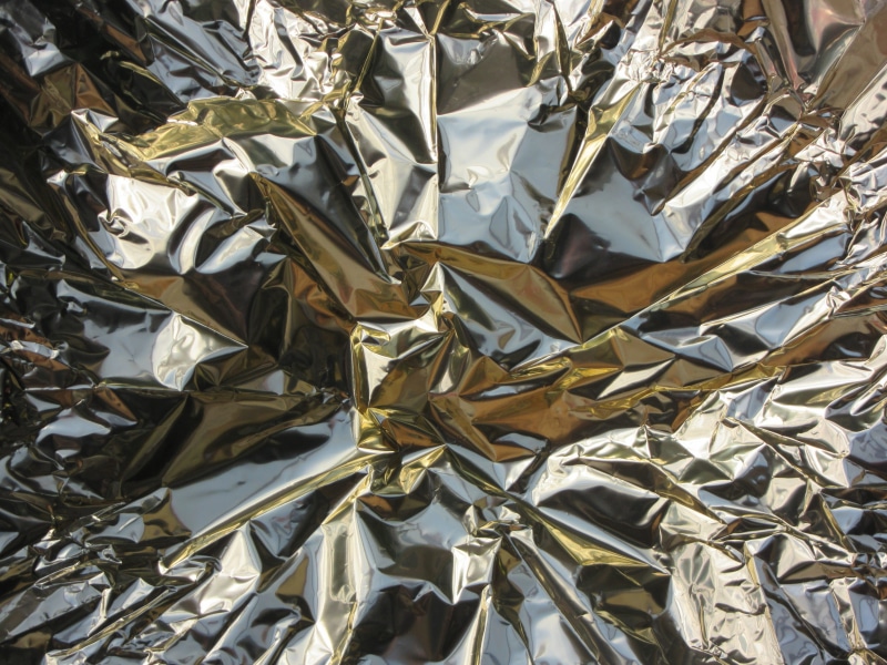 indoors, silver colored, shiny, pattern, foil - material, full frame, backgrounds, chaotic, fold, gloss, reflection, metal foil, close-up, high angle view