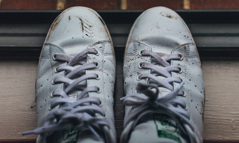 flooring, table, 5K, focus on foreground, shoes, high angle view, brown, shoelace, sneakers, pair, dirty, indoors, close-up, adidas, day, text, still life