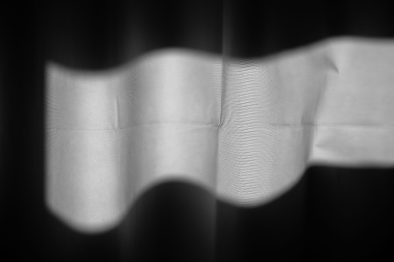 human body part, close-up, one person, hanging, adhesive tape, crease, black background, texture, domestic room, background, fabric, young adult, hand