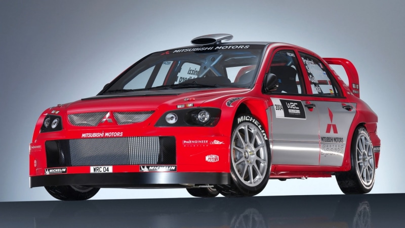 Mitsubishi, Car, transportation, red, motor vehicle, indoors, Sport, gray, studio shot, no people, land vehicle, WRC, Lancer, safety, gray background, security