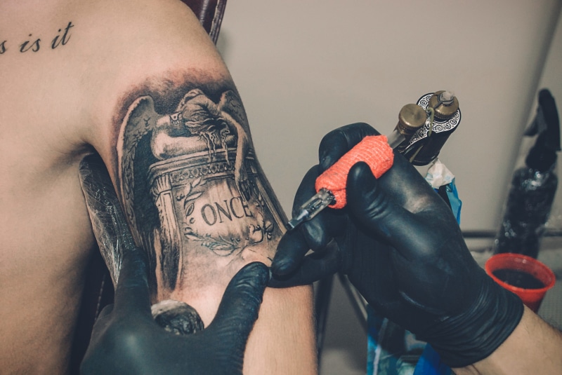 tattooing, tatoo, creativity, lifestyles, tattoo needle, once, fashion, holding, tattoo artist, man, dream, love, tattoo, statue, orange, indoors, artist