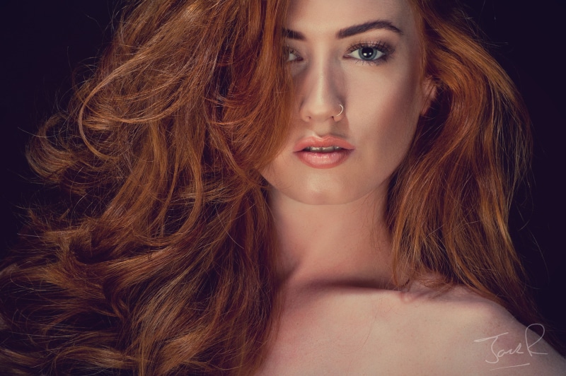 black background, human hair, one person, hairstyle, beauty, Jenny OSullivan, young adult, fashion model, beautiful people, long hair, redhead, face, body part