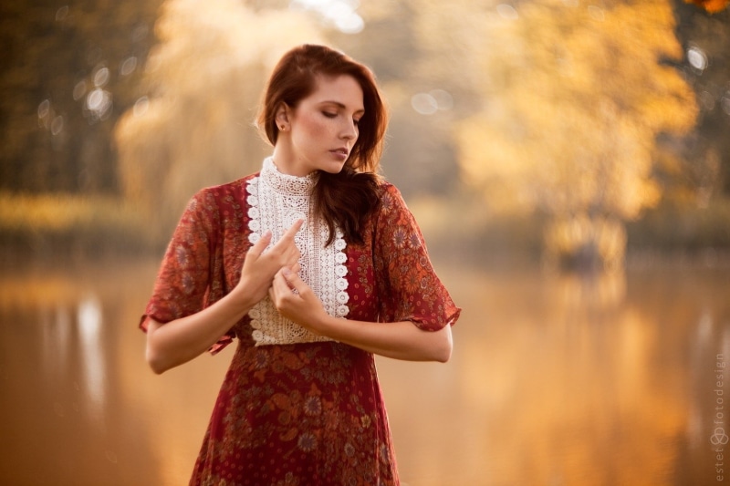 one person, women outdoors, brown hair, teenager, nature, hairstyle, long hair, beauty, standing, hair, dress, clothing, red dress, contemplation, fashion