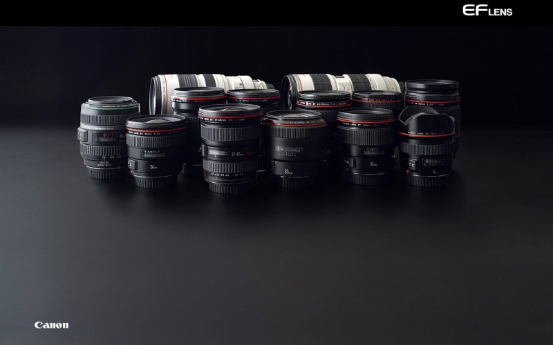 still life, cylinder, drink, in a row, container, industry, series L, Canon, lenses, stack, wood - material, black background, black, order, airtight, abundance