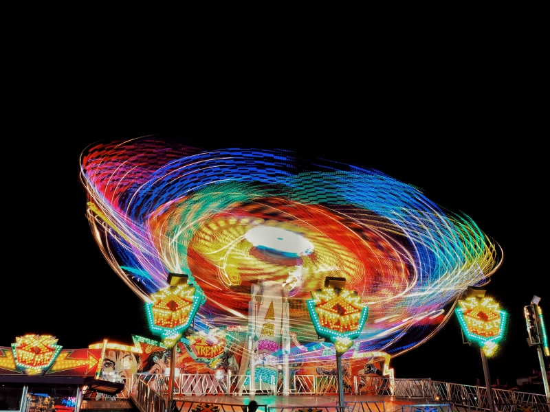 neon lights, sky, creativity, long exposure, spinning, black background, green, outdoors, arts culture and entertainment, speed, ride, low angle view, blurred motion