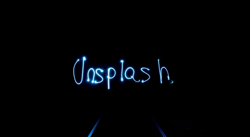 western script, message, glowing, communication, dark, lights, indoors, neon Light, overlay, background, capital letter, lighting equipment, electricity
