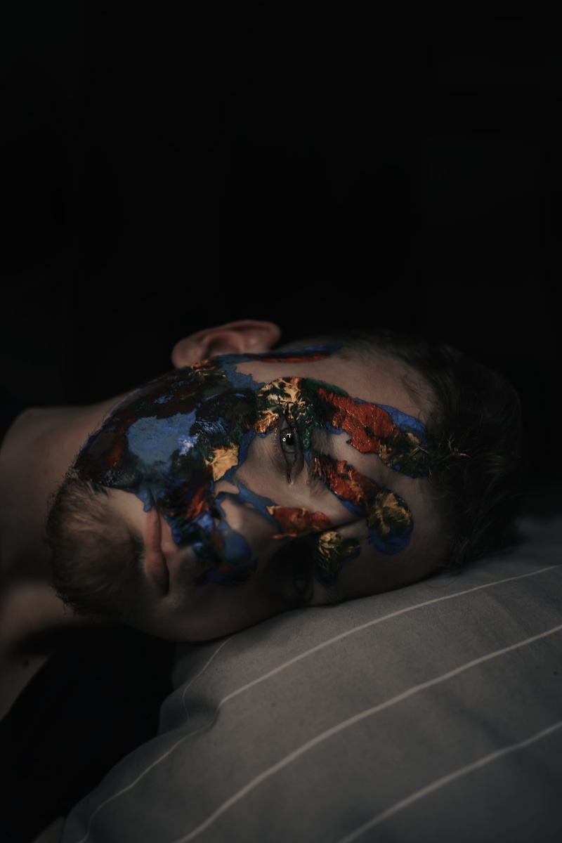 portrait, paint, emotion, headshot, paint container, #photography, face, #color, #men, human, person, young adult, black background, #art, copy space, human face