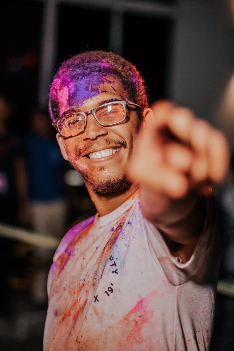 glasses, enjoyment, front view, happiness, night, man, focus on foreground, holi, one person, casual clothing, real people, powder, eyewear, action, mid adult